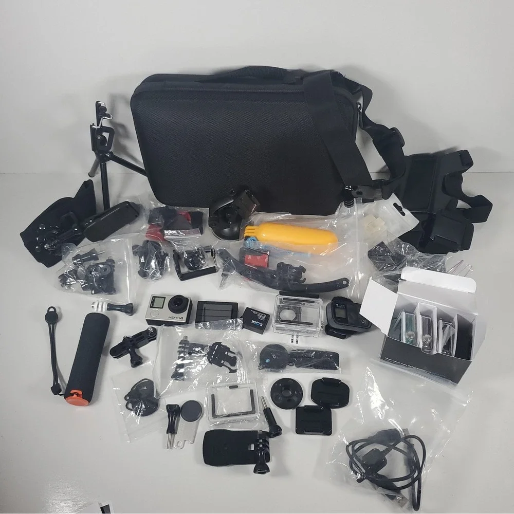 GoPro Hero4, Two Batteries, And Accessories Lot. Mounts, Body And Head Harness
